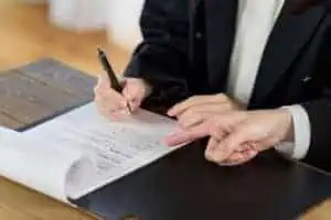 Business woman signing a contract