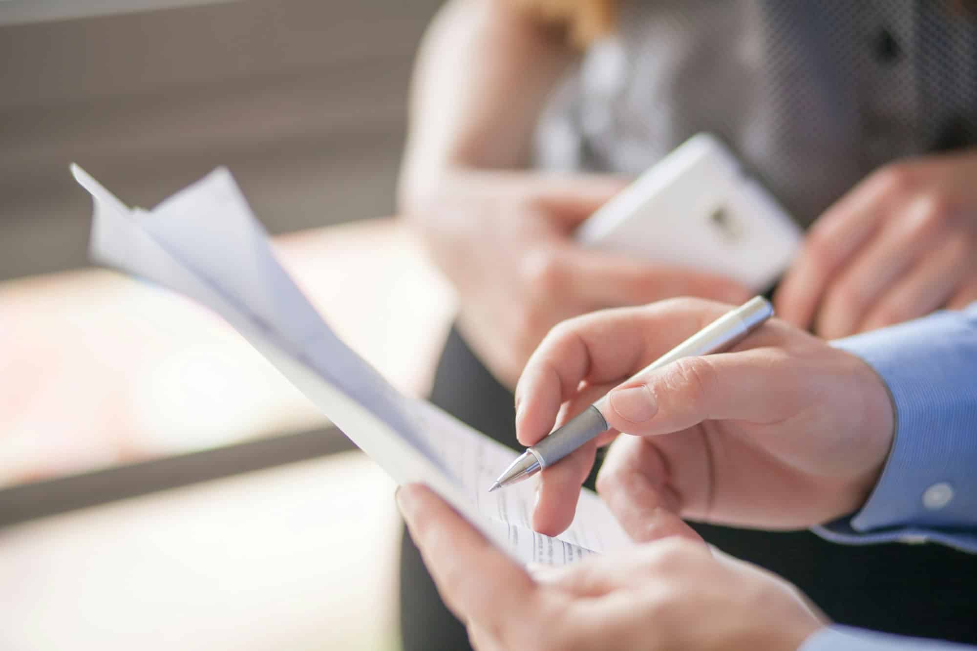 Businessman is signing a contract, business contract details