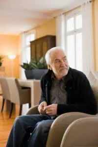 old man sitting in chair